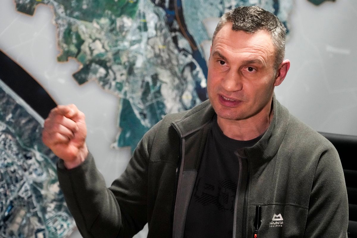 Vitali Klitschko, Kyiv Mayor and former heavyweight champion gestures while speaking during his interview with the Associated Press in his office in the City Hall in Kyiv, Ukraine, Sunday, Feb. 27, 2022. A Ukrainian official says street fighting has broken out in Ukraine