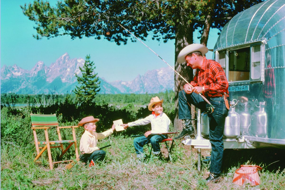 A historic advertising photo by Ardean R. Miller III shows a family enjoying the outdoors in their Airstream. (Airstream)