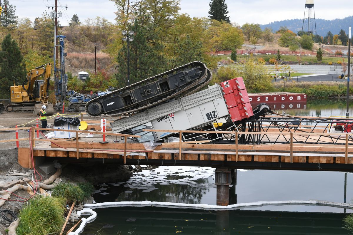 A construction crane flipped over Tuesday morning, October 29, 2024, while working near the Post Falls Dam.  (James Hanlon/The Spokesman-Review)