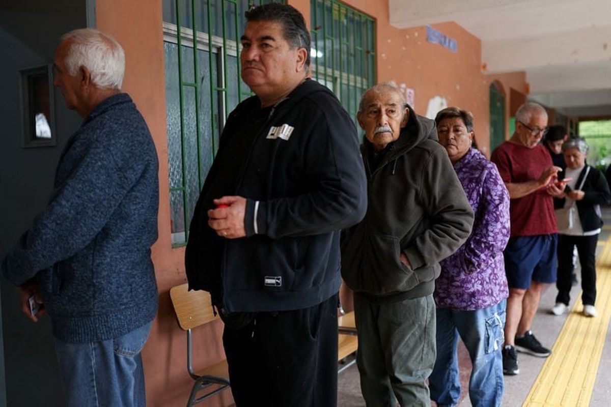 People line up to vote in the presidential runoff election on Saturday in Santiago, Chile.   (Pablo Sanhueza/Reuters )