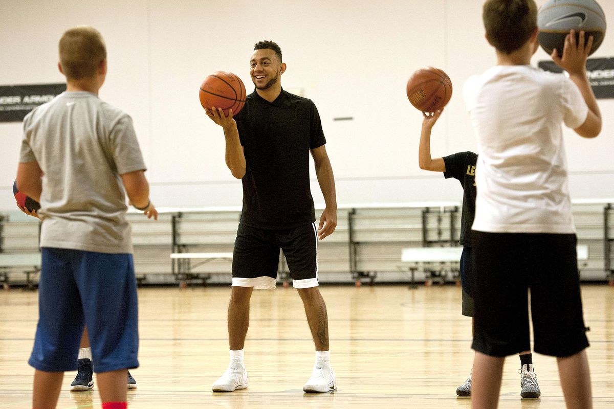 Nigel Williams-Goss shares a laugh with the kids while giving instruction during basketball camp at The Hub in Liberty Lake on Tuesday, Aug. 22, 2017. (Kathy Plonka / The Spokesman-Review)