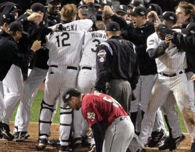 
Houston Astros pitcher Brad Lidge, bottom, hangs his head as the Chicago White Sox celebrate Scott Podsednik's game-winning homer off Lidge in Game 2. 
 (Associated Press / The Spokesman-Review)