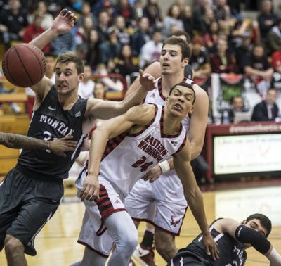 In this Jan. 7, 2017 file photo, Eastern Washington forward Jacob Wiley (24) battles Montana forward Jack Lopez for possession of the ball during a game in Cheney, Wash. (Dan Pelle / The Spokesman-Review)