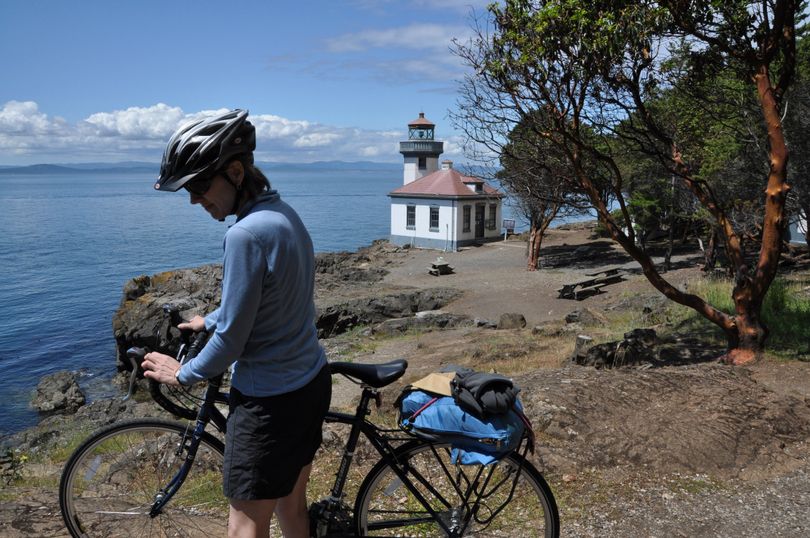  Meredith Heick of Spokane parks her bike after pedaling from Friday Harbor to Lime Kiln Point, a 36-acre Washington State Park on the west side of San Juan Island.  (Rich Landers)