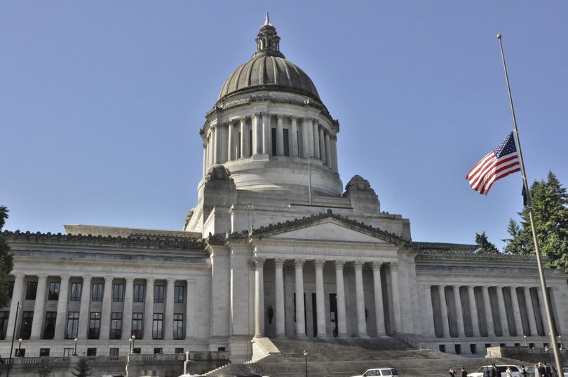 OLYMPIA -- Flags at state offices are lowered to half-staff on Friday, June 5, 2015, to honor Cpl. Joshua Barron of Spokane, who died in a training accident on May 17. (Jim Camden/Spokesman-Review)