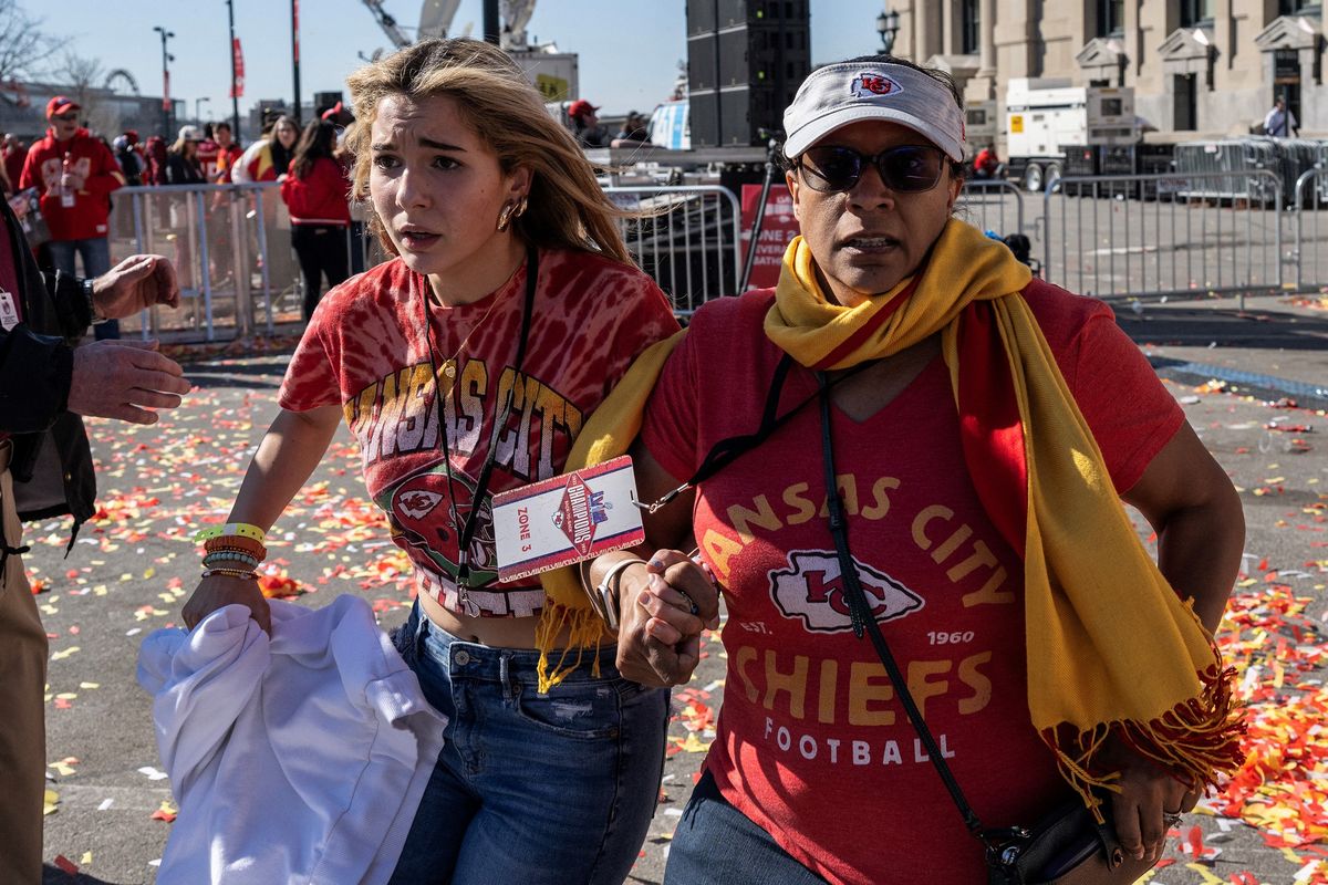 People flee after shots were fired near a the Kansas City Chiefs’ Super Bowl LVIII victory parade Wednesday in Kansas City, Mo.  (Andrew Caballero-Reynolds/AFP)