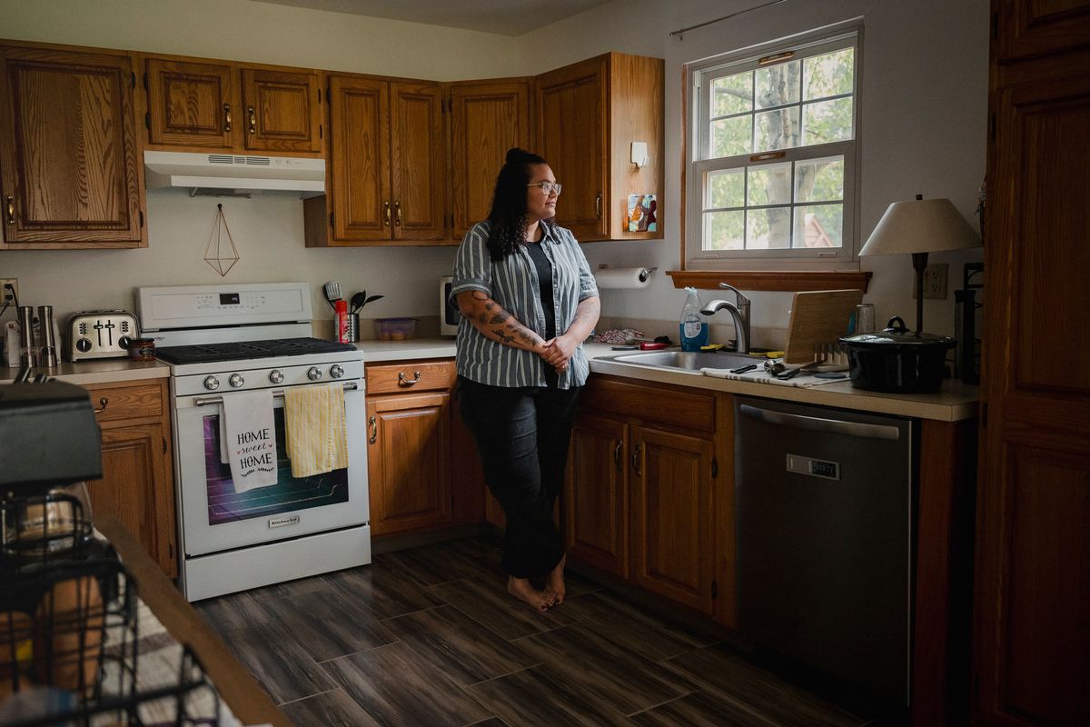 Shantel Anderson, at her home in Collegeville, Pa., earlier this month, used the student loan grace period to help her mother avoid eviction. With student loan payments restarting, she had to have a conversation with her mother about not being able to help as much.  (HANNAH YOON)