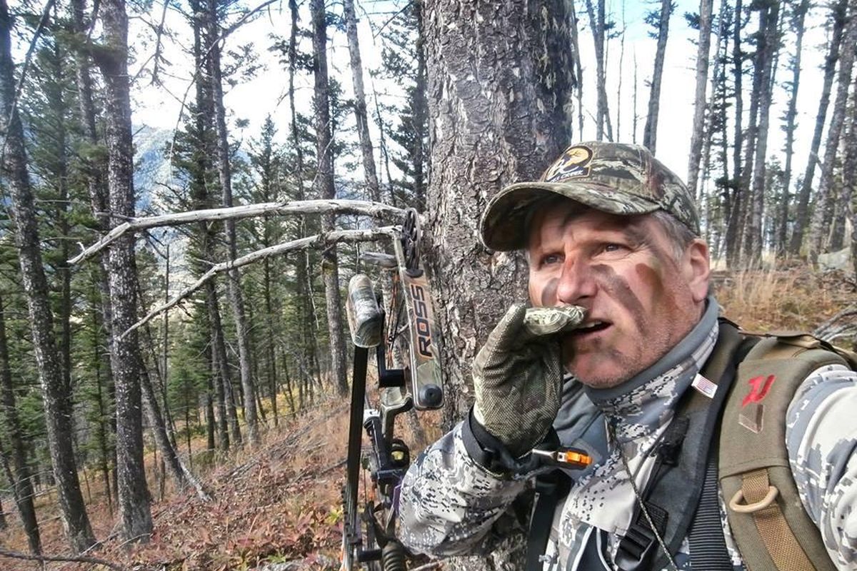 Bob Legasa of Hayden, Idaho, mouths a cow elk call while bowhunting for bull elk in Montana in September 2015. (Courtesy photo / Courtesy photo)