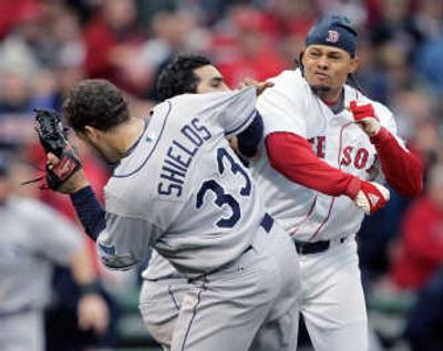
Boston's Coco Crisp, right, takes a swing at Rays pitcher James Shields. Associated Press
 (Associated Press / The Spokesman-Review)