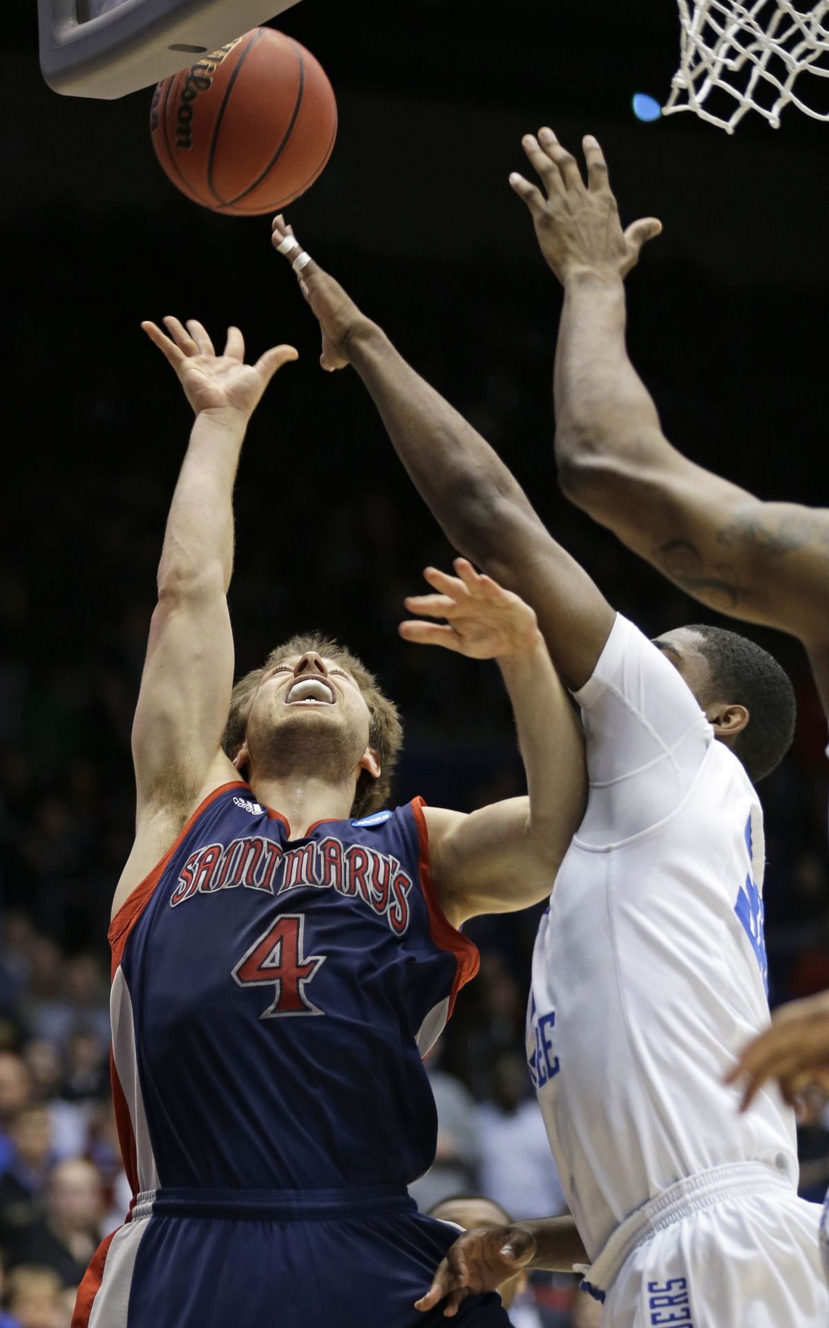 It didn’t happen often: Matthew Dellavedova getting a shot blocked, here by Middle Tennessee’s JT Sulton. (Associated Press)