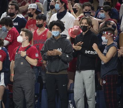 Two prospective Zag recruits, Jared McCain, center left, (in Yankees sweatshirt) and Dusty Stromer, right, watch the Zags beat St. Mary's Saturday, Feb. 12, 2022 in the McCarthey Athletic Center at Gonzaga in Spokane, Washington.  (Jesse Tinsley / The Spokesman-Review)