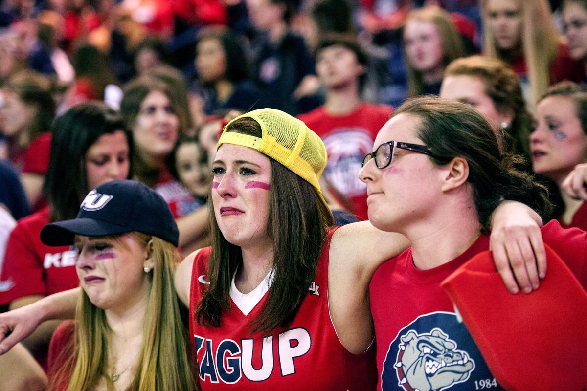 Zag fans from left, Micaela Meadows, Allison Drescher, and Megan Lavagnino react during the last seconds of the game against North Carolina during the viewing party at the McCarthey Athletic Center on Monday, April 3, 2017. (Kathy Plonka / The Spokesman-Review)