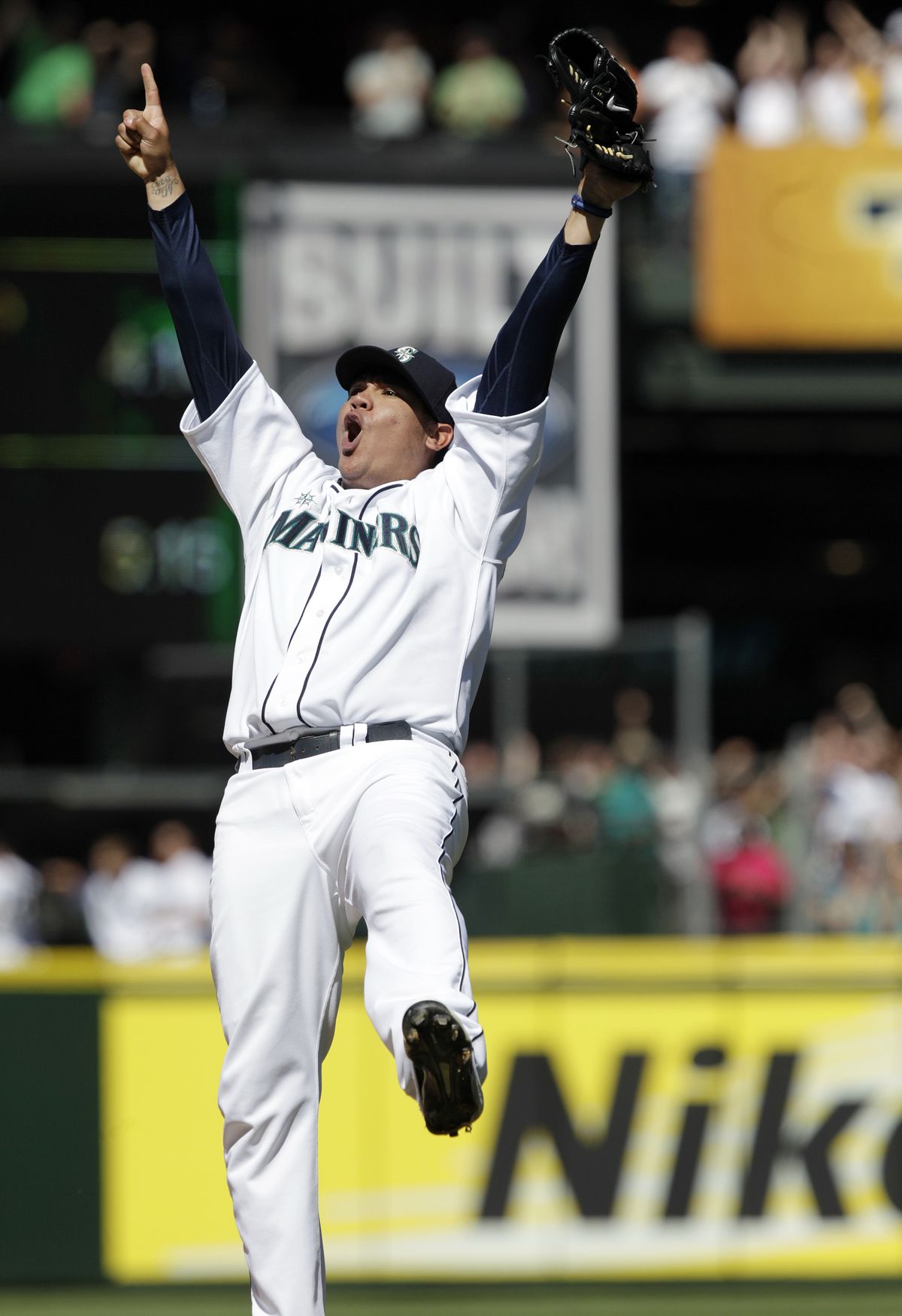 Mariners pitcher Felix Hernandez celebrates his perfect game Aug. 15 in Seattle. (Associated Press)