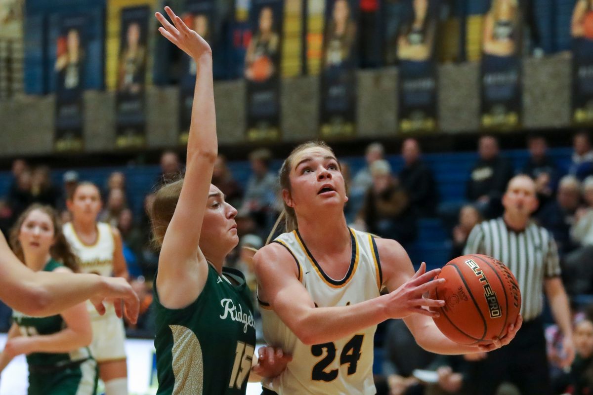 Mead’s Teryn Garnder scores two of her 17 points against visiting Ridgeline on Tuesday.  (CHERYL NICHOLS/For The Spokesman-Review)
