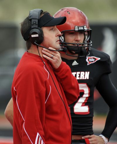 EWU head football coach Beau Baldwin has a chat with QB Anthony Vitto during the Red-White Game on April 28, 2012.  (Dan Pelle)