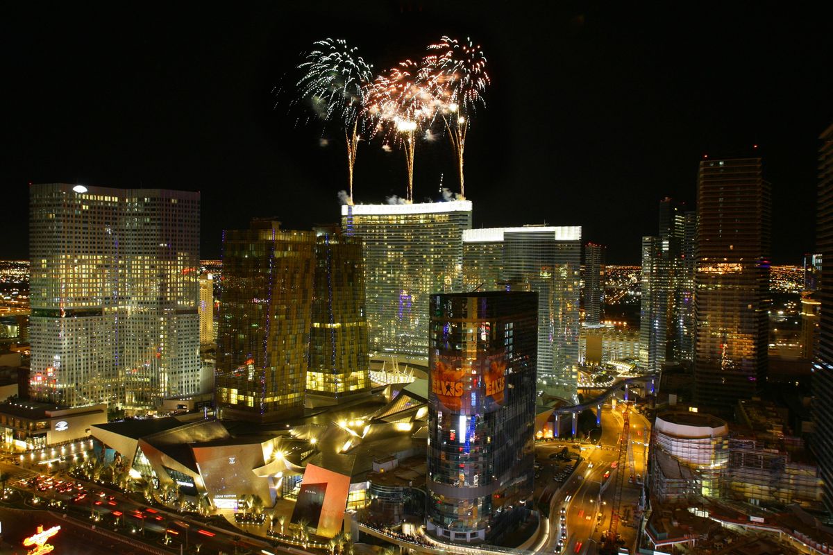 Fireworks shoot off of the roof of the Aria Hotel and Casino moments before its opening at CityCenter on The Strip in Las Vegas in December. The extra rooms added to the Las Vegas market will create more pricing pressure for struggling casinos. (File Associated Press)