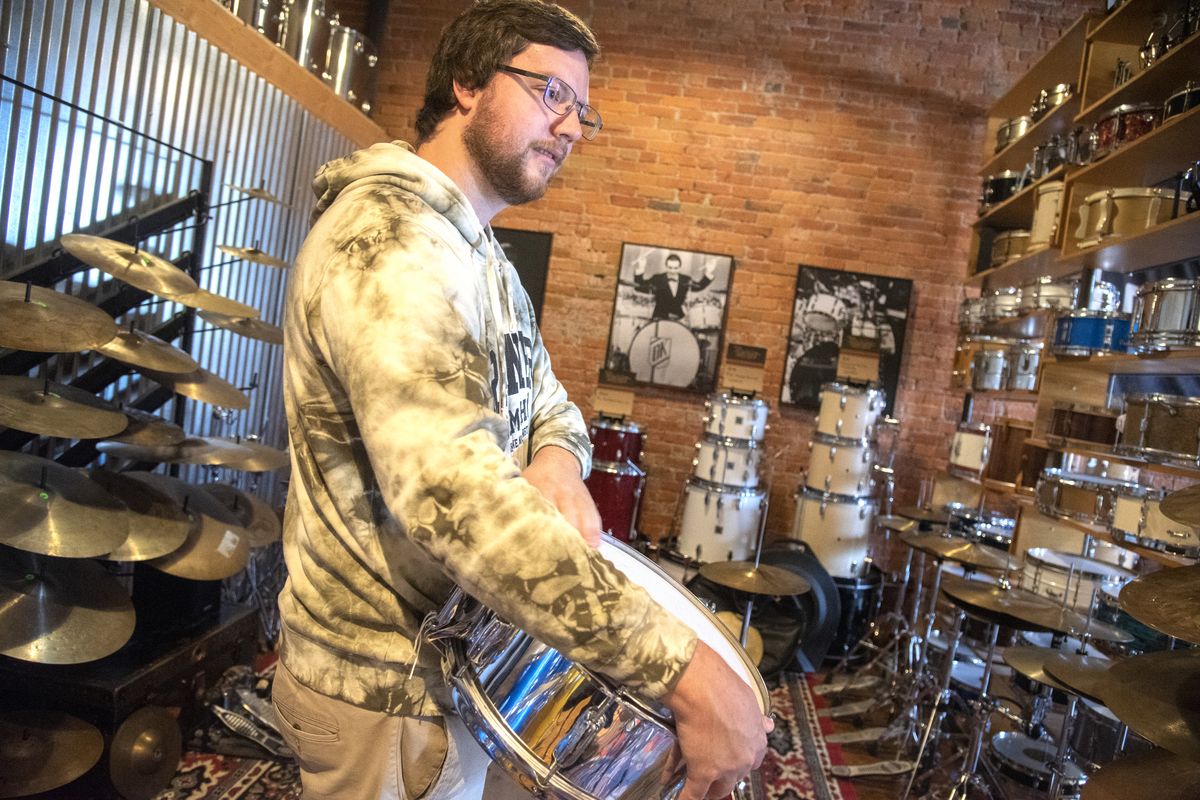 Manager Josh Fry is part of the partnership that owns Rainier Drum Shop on Pacific Avenue in downtown Spokane.  (Jesse Tinsley/The Spokesman-Review)