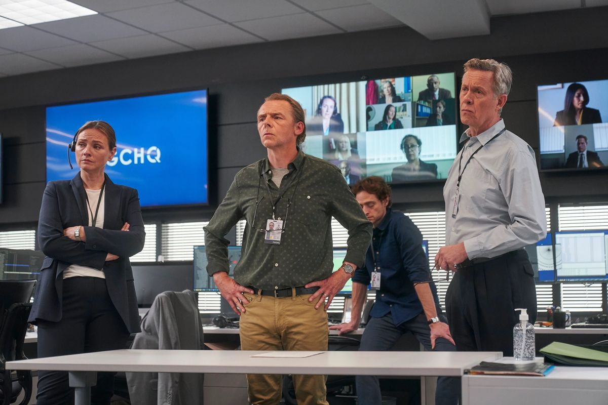Hannah Khalique-Brown, Simon Pegg, and Alex Jennings in “The Undeclared War.”  (Playground Entertainment / Peacock)