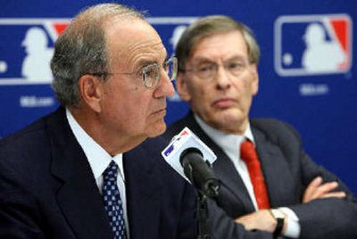 
George Mitchell, left, seated with Bud Selig, has run into some stonewalling.
 (Associated Press / The Spokesman-Review)