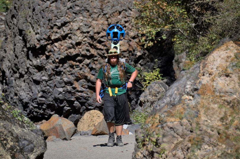 Volunteer Andy Fuzak hikes with the Google Trekker up Deep Creek Canyon in Riverside State Park. (Rich Landers)