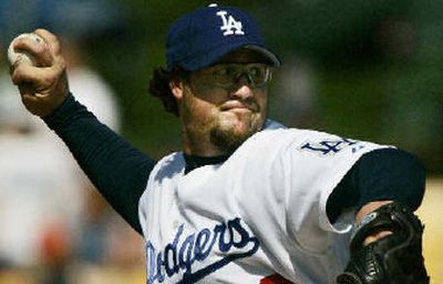 
L.A. closer Eric Gagne is expected to miss 6 to 8 weeks after undergoing surgery.
 (Associated Press / The Spokesman-Review)