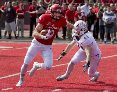 Eastern Washington’s Cooper Kupp, eluding Montana State‘s Grant Collins, is the winner of the Walter Payton Award. (Dan Pelle / The Spokesman-Review)