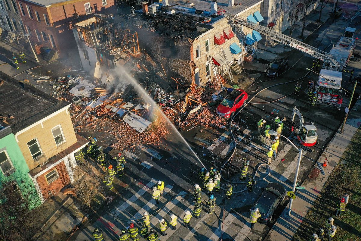 Dozens of Baltimore firefighters at the scene in Baltimore’s Pigtown neighborhood on Tuesday.  (Jerry Jackson/Baltimore Sun/TNS)