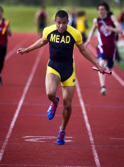 Mead anchor man Wes Bailey crosses the finish line to win the 400-meter relay Thursday at Mt. Spokane. (Colin Mulvany)