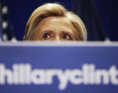 Democratic presidential candidate Hillary Rodham Clinton peers over a podium while addressing an audience during a campaign stop at Trident Technical College, Wednesday, June 17, 2015, in North Charleston, S.C.  (David Goldman / AP file photo)