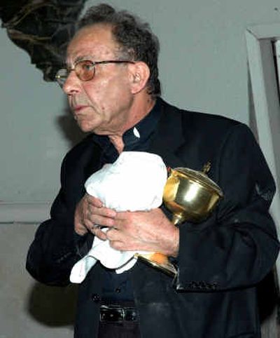 
A Catholic priest collects his belongings inside St. John's Church following a bombing in the adjacent al-Mahabba Christian radio station in Jounieh, north of Beirut.
 (Associated Press / The Spokesman-Review)