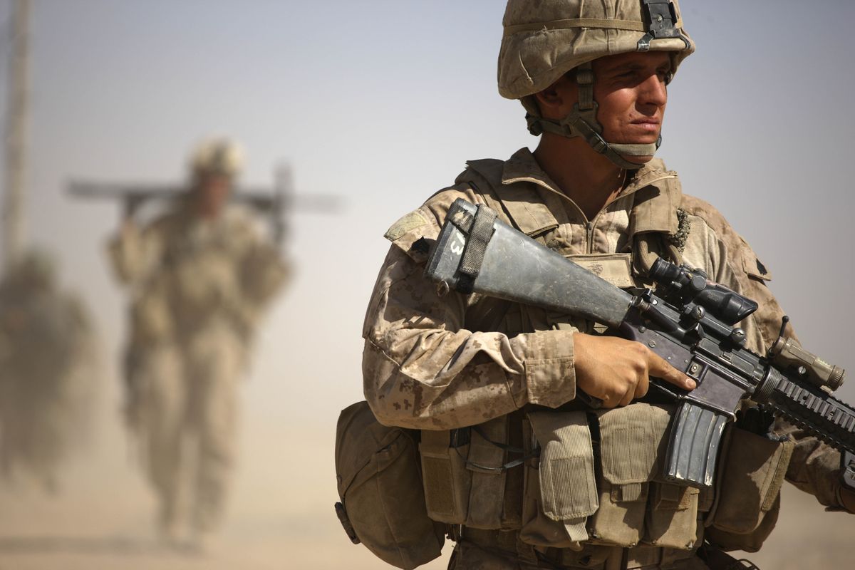 A U.S. Marine with Bravo Company, 1st Battalion 5th Marines walks in a joint patrol with Afghan National Army soldiers, in Nawa district, Helmand province, on Oct. 3.