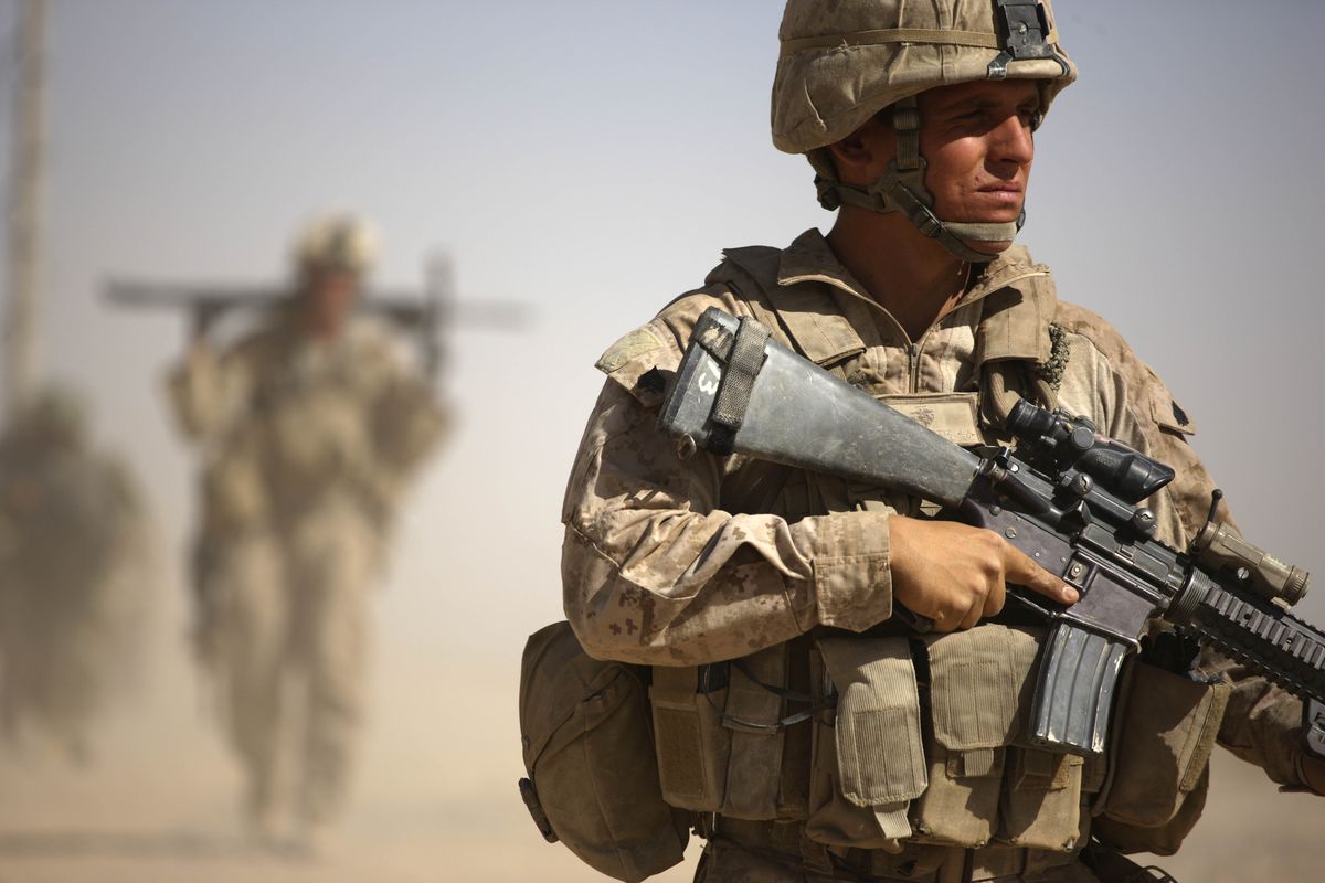 A U.S. Marine with Bravo Company, 1st Battalion 5th Marines walks in a joint patrol with Afghan National Army soldiers, in Nawa district, Helmand province,  on Oct. 3.