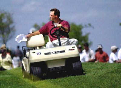 
Golfer Casey Martin had to go all the way to the Supreme Court to get the right to use a golf cart in PGA Tour events. 
 (Associated Press / The Spokesman-Review)