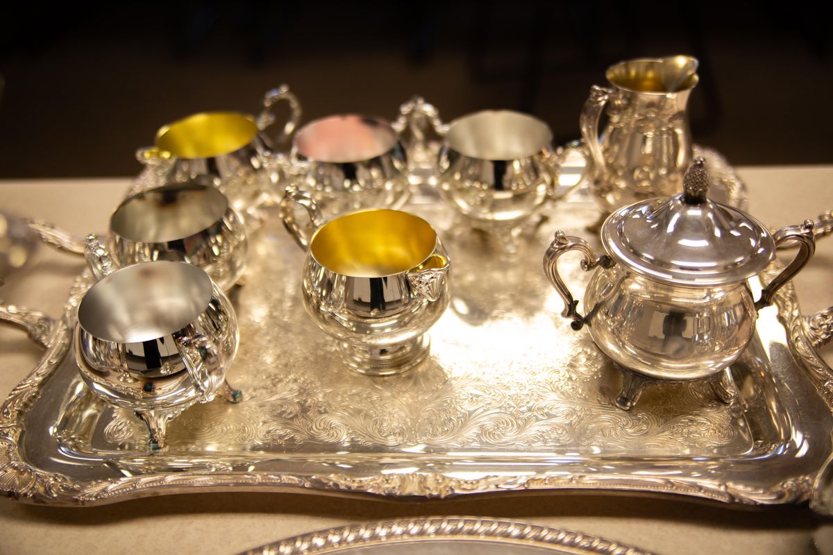 A silver tea set is seen on a platter on Feb. 5, 2019 at Spokane Fire Department Station No. 4. The items were recently recovered from a 5-foot by 4-foot safe during SFD’s tactical training at the old YWCA building on 829 W. Broadway Ave. (Libby Kamrowski / The Spokesman-Review)