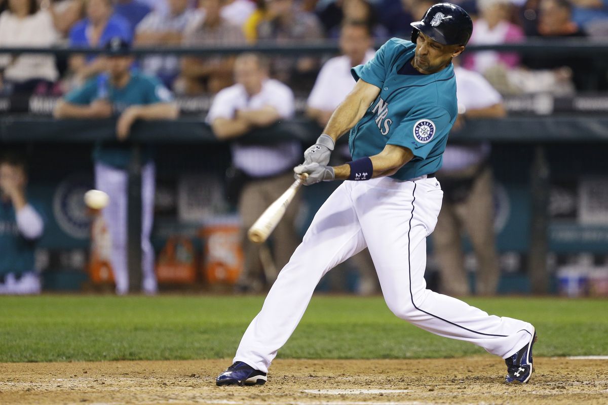 Raul Ibanez of the Mariners hits an RBI single in the sixth inning. He also hit his 22nd home run of the season. (Associated Press)