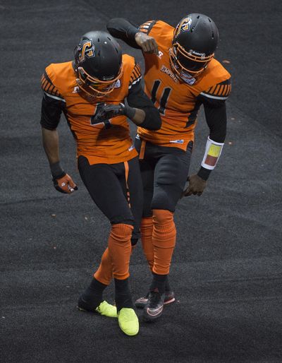 Empire receiver Carl Sims, left, will miss the rest of the Indoor Football League season after breaking his wrist. (Colin Mulvany / The Spokesman-Review)