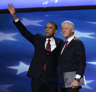 President Barack Obama waves as he joins Former President Bill Clinton during the Democratic National Convention in Charlotte, N.C., on Wednesday, Sept. 5, 2012. (Charles Dharapak / Associated Press)