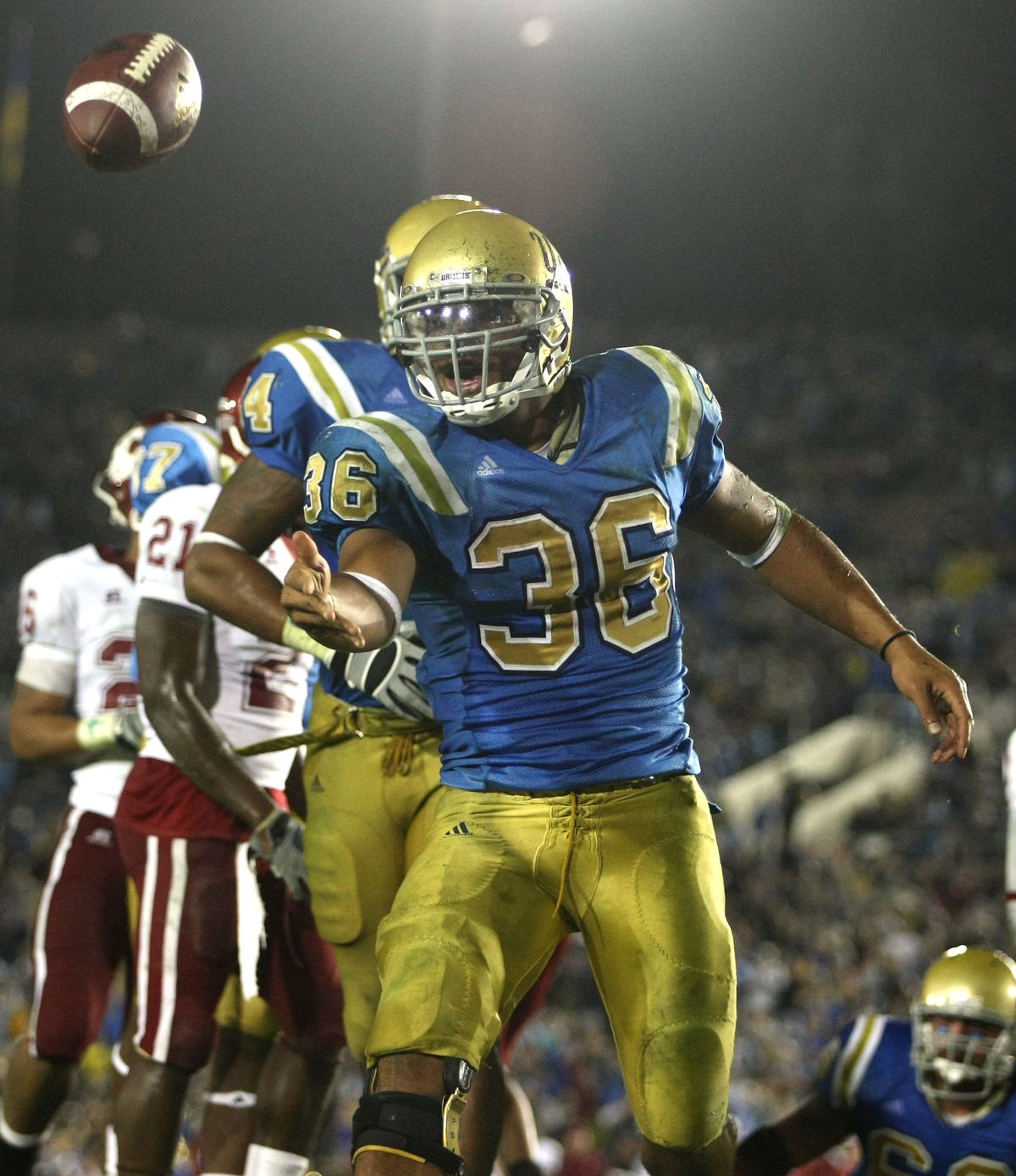 UCLA’s Kahlil Bell celebrates after scoring against WSU. Before Saturday, UCLA had lost six of seven to WSU. (Associated Press / The Spokesman-Review)
