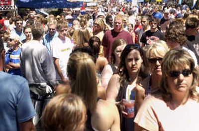 
It was slow going as Hoopfest crowds were huge and the foodlines long in Riverfront Park.  
 (J. BART RAYNIAK / The Spokesman-Review)