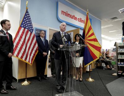 U.S. Sen. John McCain, R-Ariz., speaks Tuesday at a CVS “MinuteClinic” in Tempe, Ariz. to announce a pilot program that allows ailing veterans who receive treatment at the Phoenix VA medical center to access one of 24 “MinuteClinics” operated by CVS for treatment of minor illnesses and injuries, such as respiratory infections or to order lab tests. Three years after a wait-time scandal, the Veterans Affairs Department is hoping a private-sector partnership with the CVS Pharmacy chain will reduce some of its strain in providing timely urgent care. (Matt York / Associated Press)