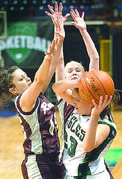 
Reardan's Mandy Peone, left, and Sara Wilke apply defensive pressure to Kelsey D'Andrade. 
 (Colin Mulvany / The Spokesman-Review)