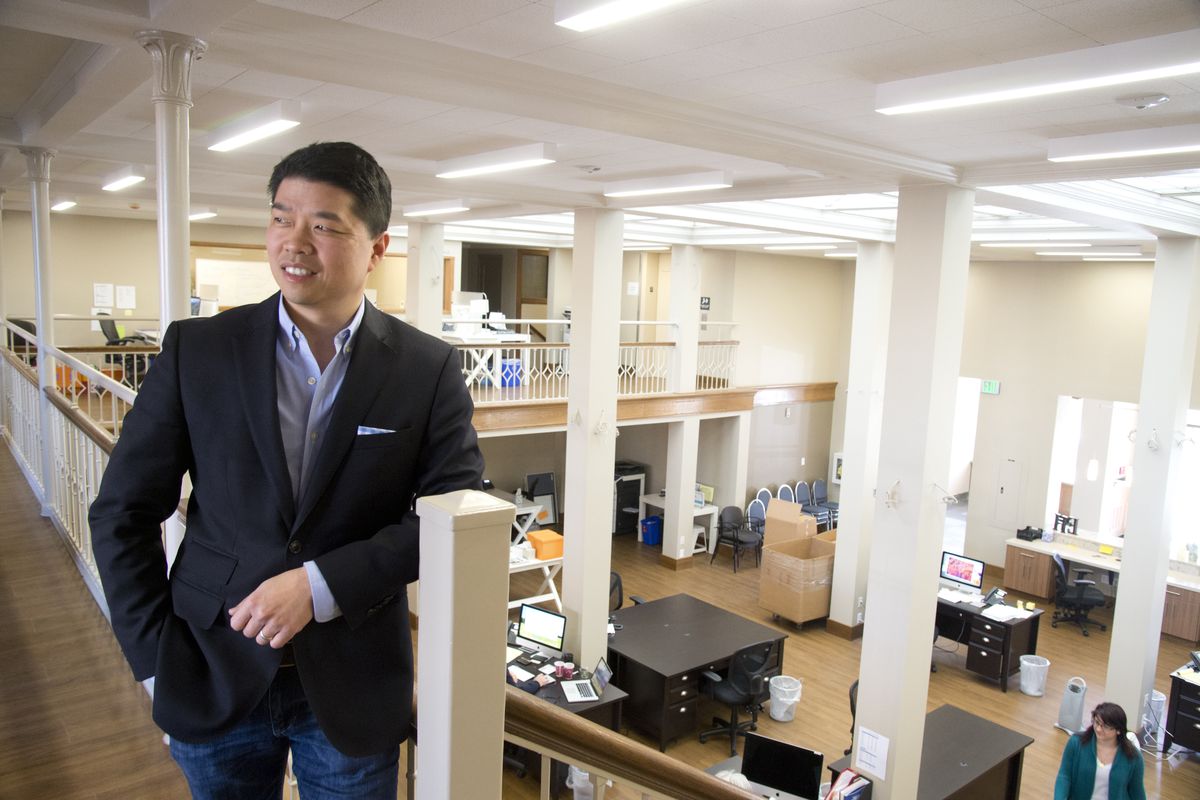 Antony Chiang, president of Empire Health Foundation, stands March 13 on the balcony inside the former Chamber of Commerce building, where his foundation is moving and upgrading the building. (Jesse Tinsley)