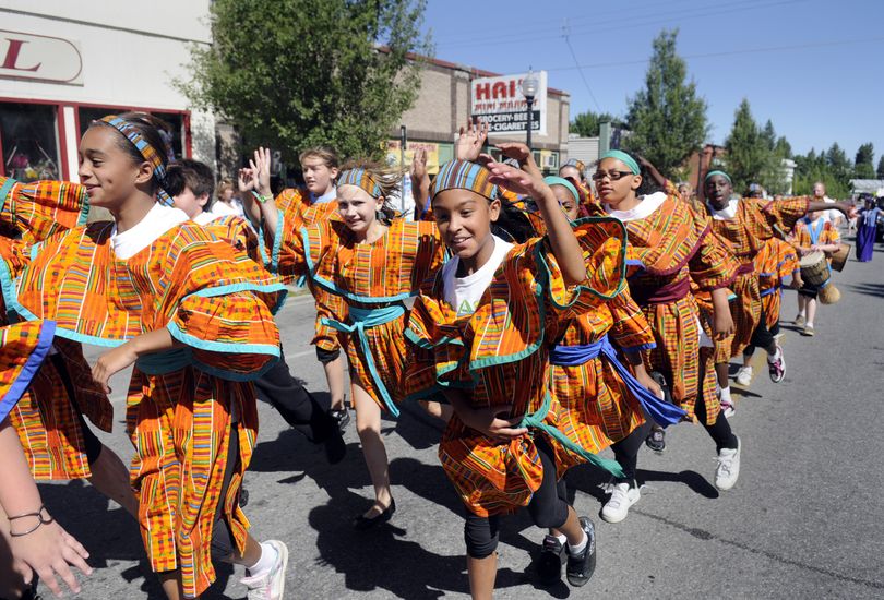 Salliena Nyberg (cq), center, a sixth-grader at Grant Elementary, performs with the Grant Elementary Drummers and Dancers down Perry Street during the South Perry Parade and Fair Saturday, July 16, 2010. (Jesse Tinsley / The Spokesman-Review)