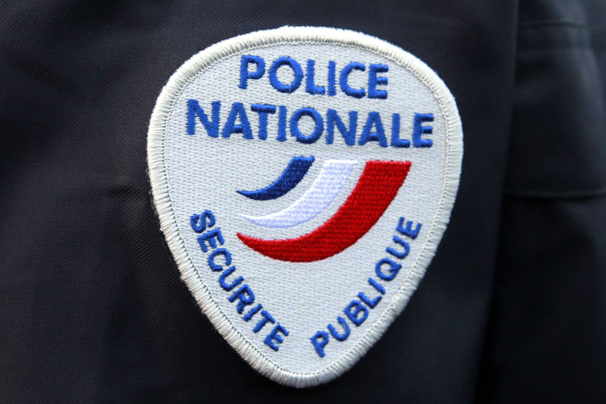 This March 18, 2015 file photo shows the logo of the French national police during a ceremony in Paris. Thousands of French women have denounced in a new online campaign the shocking response of police officers victim-blaming them or mishandling their complaints as they were reporting sexual abuse. (Remy de la Mauviniere)