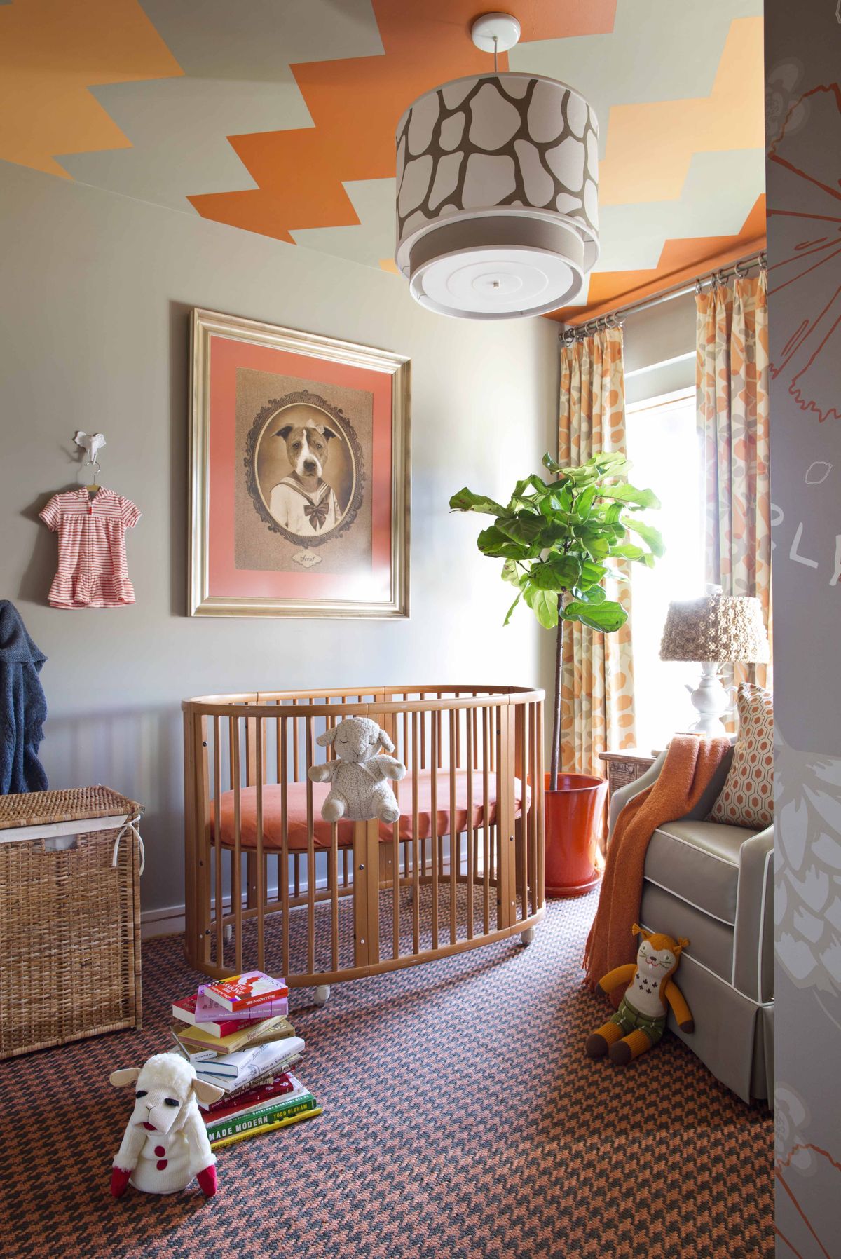 An autumnal nursery designed by Brian Patrick Flynn with ceramic animal hooks for infant clothing in the Brooklyn borough of New York. The hooks add storage space and decorative flair, while making sure favorite outfits get used before the baby grows out of them.