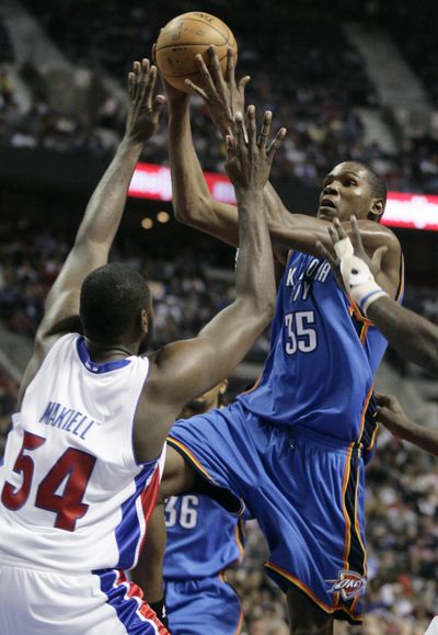 Thunder forward Kevin Durant drives the lane in 91-83 victory. (Associated Press / The Spokesman-Review)