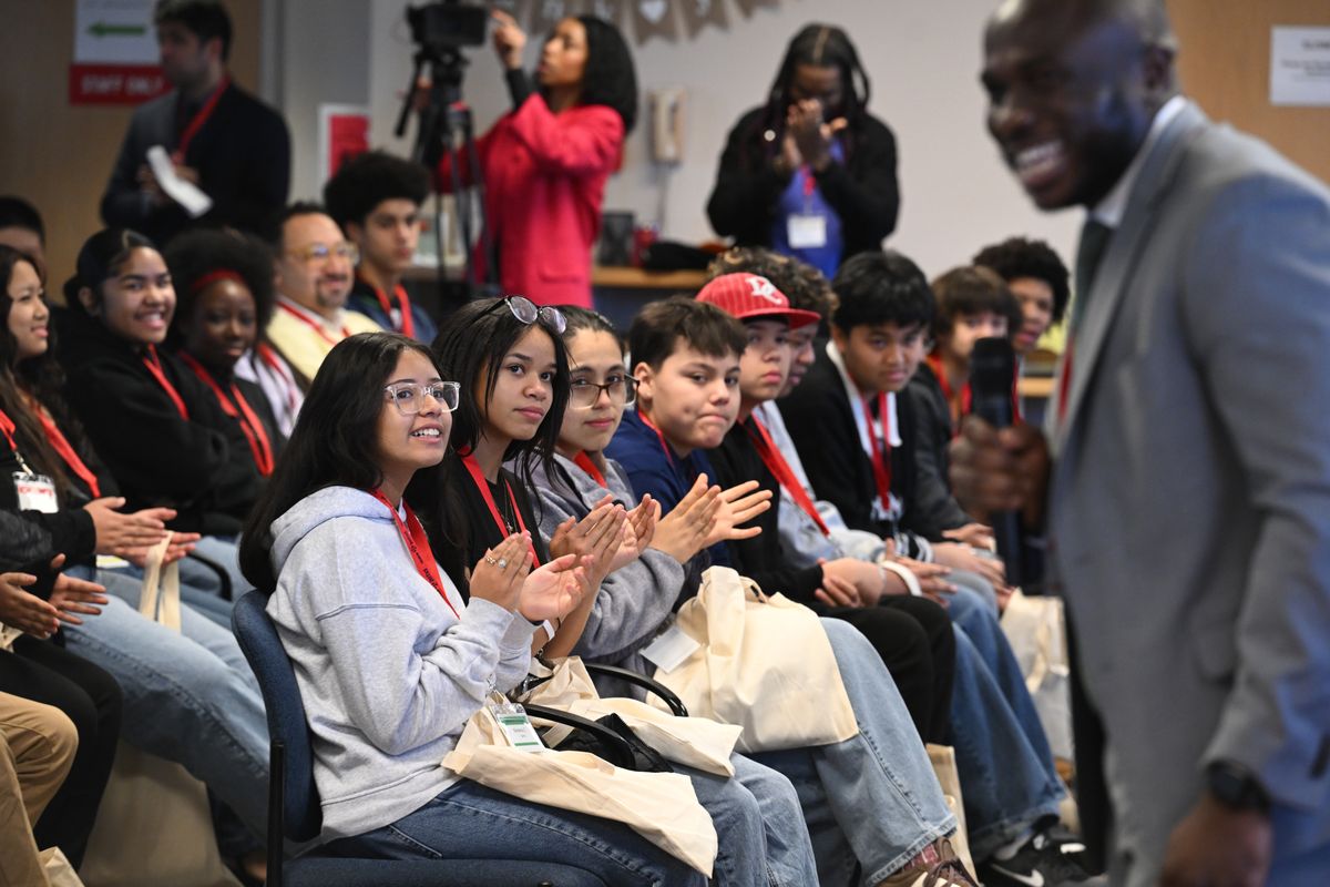Middle school students from around the Spokane area listen to public defender Simon Menso, right, talk about his job at Color of Justice, a day focused on exposing kids to careers in law and justice on Friday at the Spokane County Courthouse.  (Jesse Tinsley/THE SPOKESMAN-REVI)