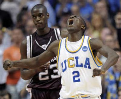 
Darren Collison celebrates his basket that put UCLA ahead of Texas A&M in the final minute of Saturday's game.Associated Press
 (Associated Press / The Spokesman-Review)