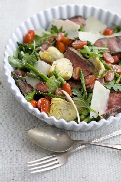 To make this salad of steak and spring vegetables, use the grill to cook and flavor the meat, as well as many of the other components. (Associated Press)