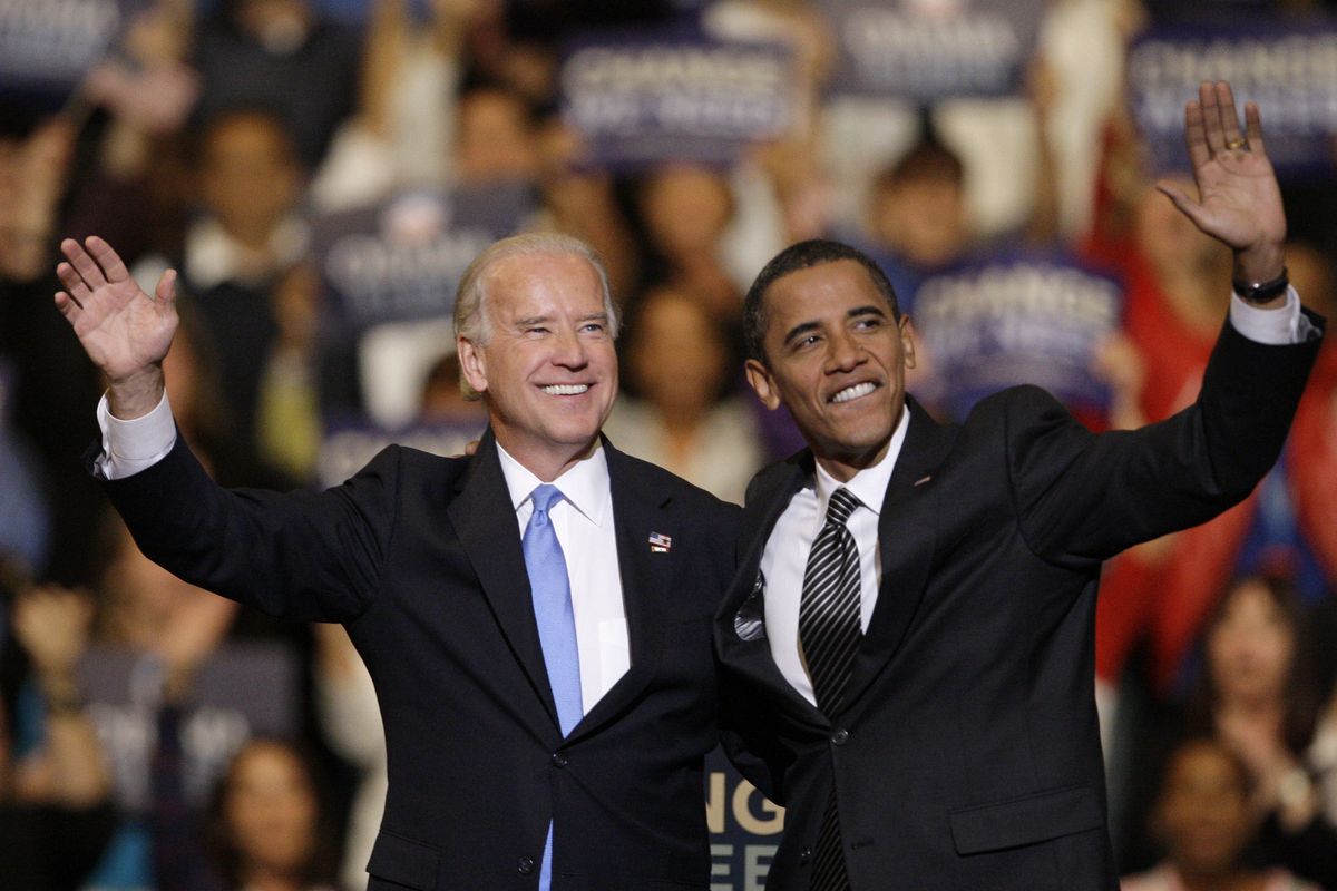 FILE - In this Oct. 29, 2008, file photo Vice presidential candidate Joe Biden, D-Del., left, and Democratic presidential candidate Sen. Barack Obama, D-Ill., right, wave during a rally at the Bank Atlantic Center in Sunrise, Fla.  (Lynne Sladky)